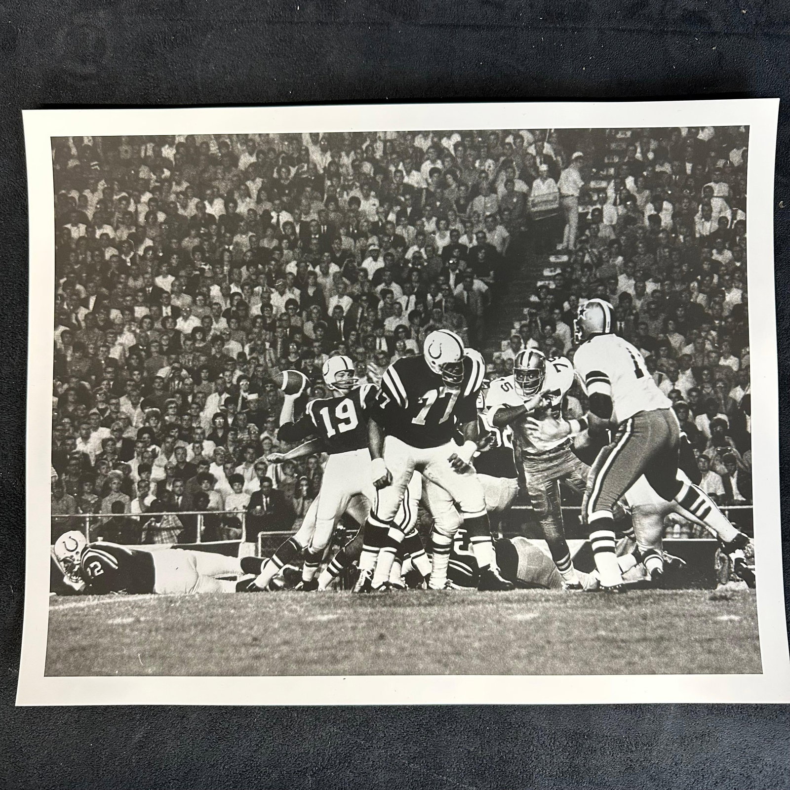Johnny Unitas Super Bowl V Silver Gelatin Print: Black-and-white analog photo print capturing Johnny Unitas (#19) of the Baltimore Colts in action during Super Bowl V against the Dallas Cowboys. A striking game moment showcasing Unitas preparing to