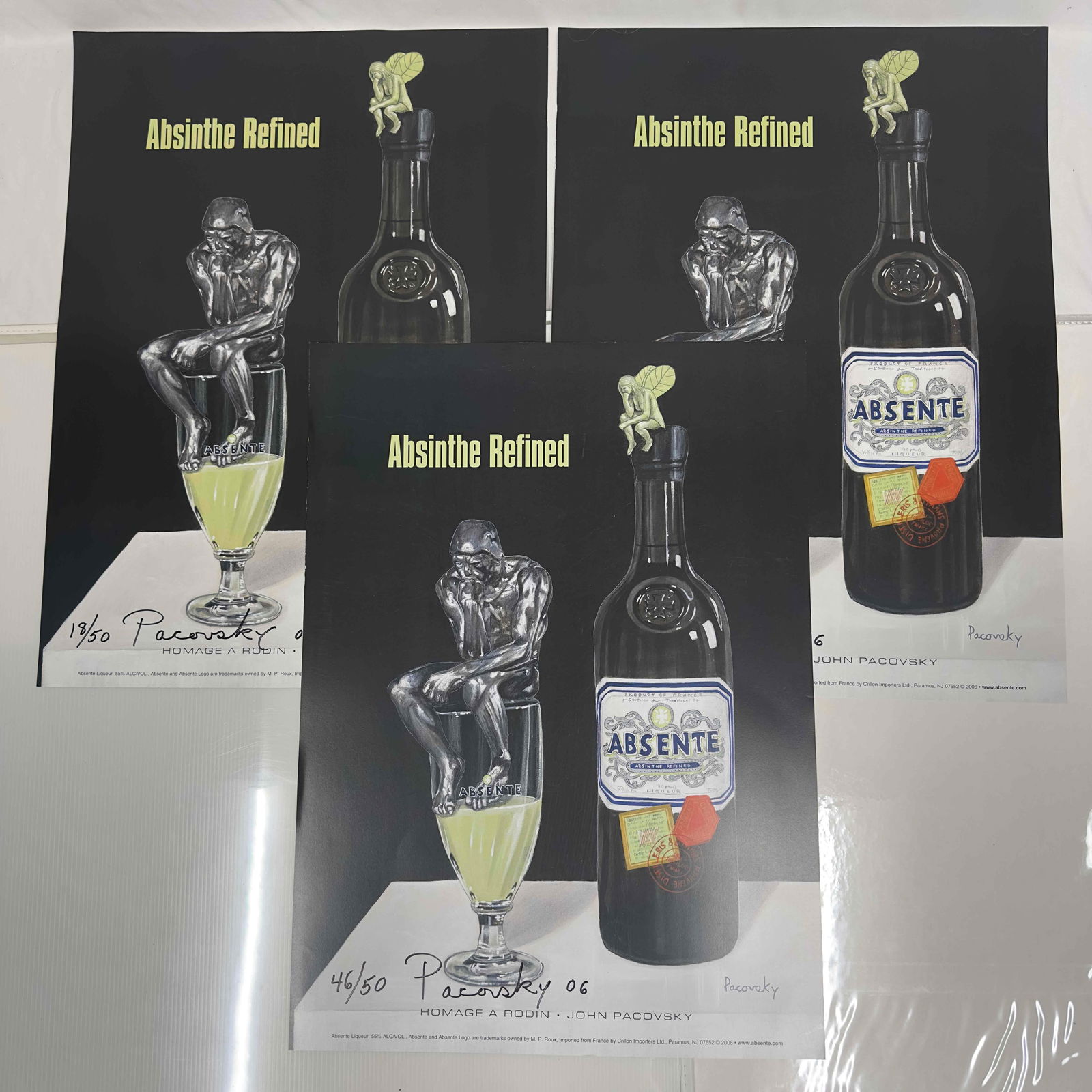 Absinthe Refined Ad Poster Homage A Rodin by John Pacovsky Hand Signed and Numbered: Absinthe Refined Ad Poster Homage A Rodin by John Pacovsky Hand Signed and Numbered. This set includes three (3) hand signed and numbered posters by John Pacovsky. Limited Edition 50, from 2006. A few