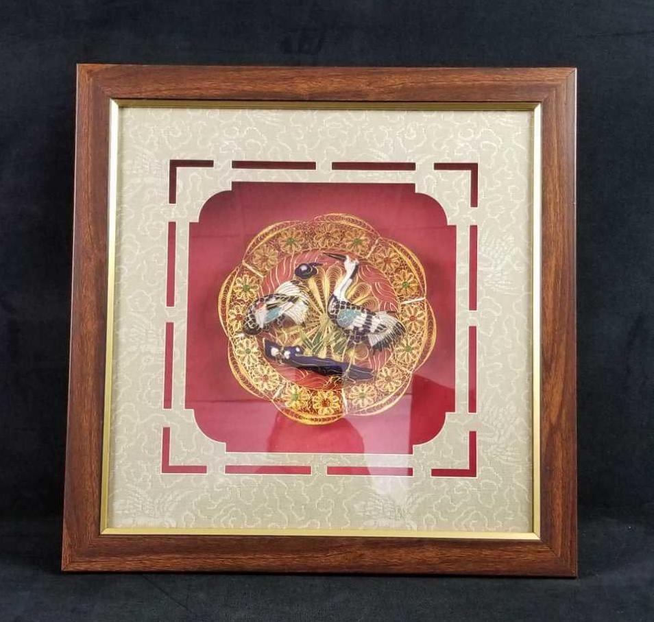 Cloisonne Filigree Red Crowned Cranes Gold Plate: This plate has a gold tone filigree and Red Crowned Cranes in an enamel cloisonne design. The plate is set in a shadow box and Asian matte design. The maker and date is unknown. In good vintage c