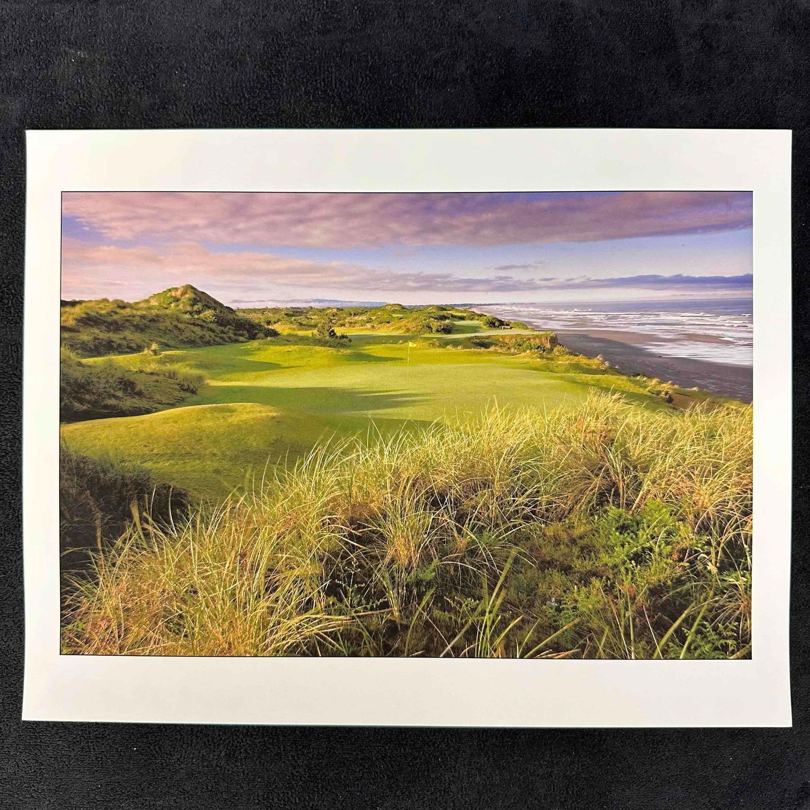 Bandon Dunes Coastal Golf Course Photograph Color Print BD1: High quality color print featuring a scenic view of Bandon Dunes Golf Resort with its iconic oceanfront green. The image highlights lush rolling fairways, rugged dunes, and the dramatic Pacific coastl