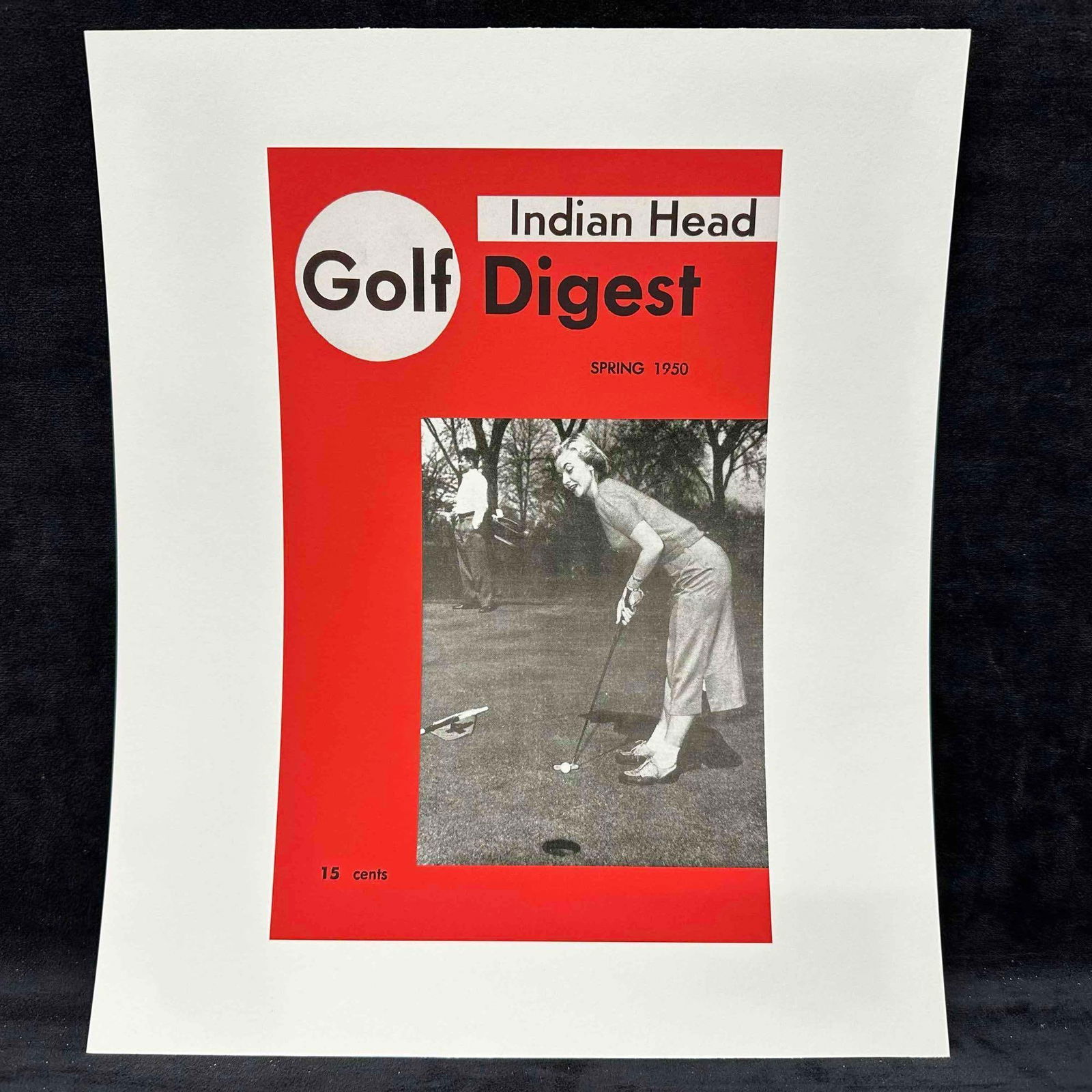 Golf Digest Indian Head Magazine Cover Reprint Spring 1950 Lithograph C: Vintage reprint of the Spring 1950 issue of Indian Head Golf Digest, featuring a black-and-white photograph of a woman golfer putting on the green, with a male golfer in the background. Cover printed