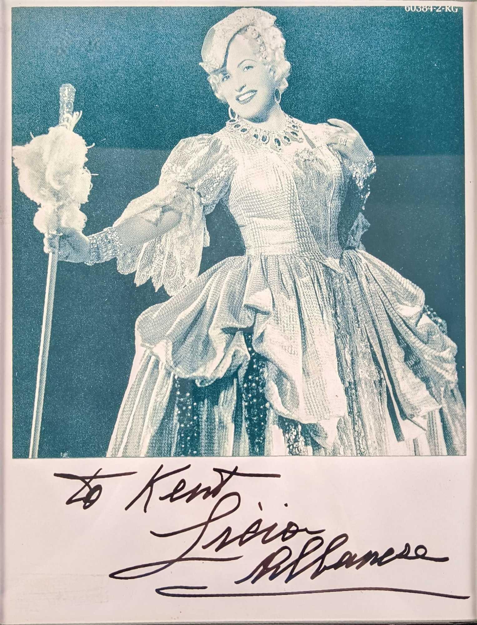 Autographed Licia Albanese Publicity Photo Print Oprea: Autographed Licia Albanese Publicity Photo Print. Appears to be dressed as Manon Lescaut from Giacomo Puccini's production of the same name. The framed photo is approx 8 1/2" x 1/2" x 11&#