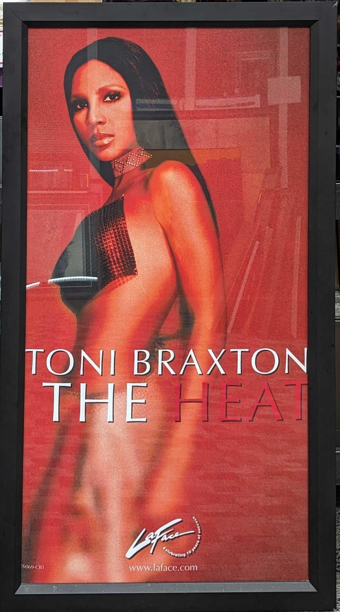 Framed Toni Braxton Heat Original Promotional Poster: Framed Toni Braxton Heat Original Promotional Poster. This framed poster is approx 26 3/4" x 1 1/2" x 48 1/2" and it weighs 14.70 lbs. The framed poster is in a good, used condition with s