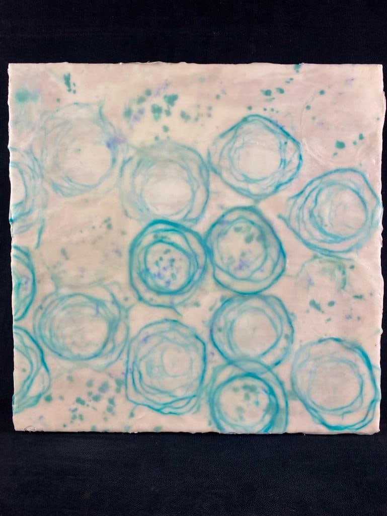 Etta Jean Juge Untitled Encaustic Mixed Media: Etta Jean Juge Untitled Encaustic Mixed Media This piece by Etta Jean Juge is an encaustic mixed media painting done on a wooden board. It features blue rings suspended in the ethereal layers of whit