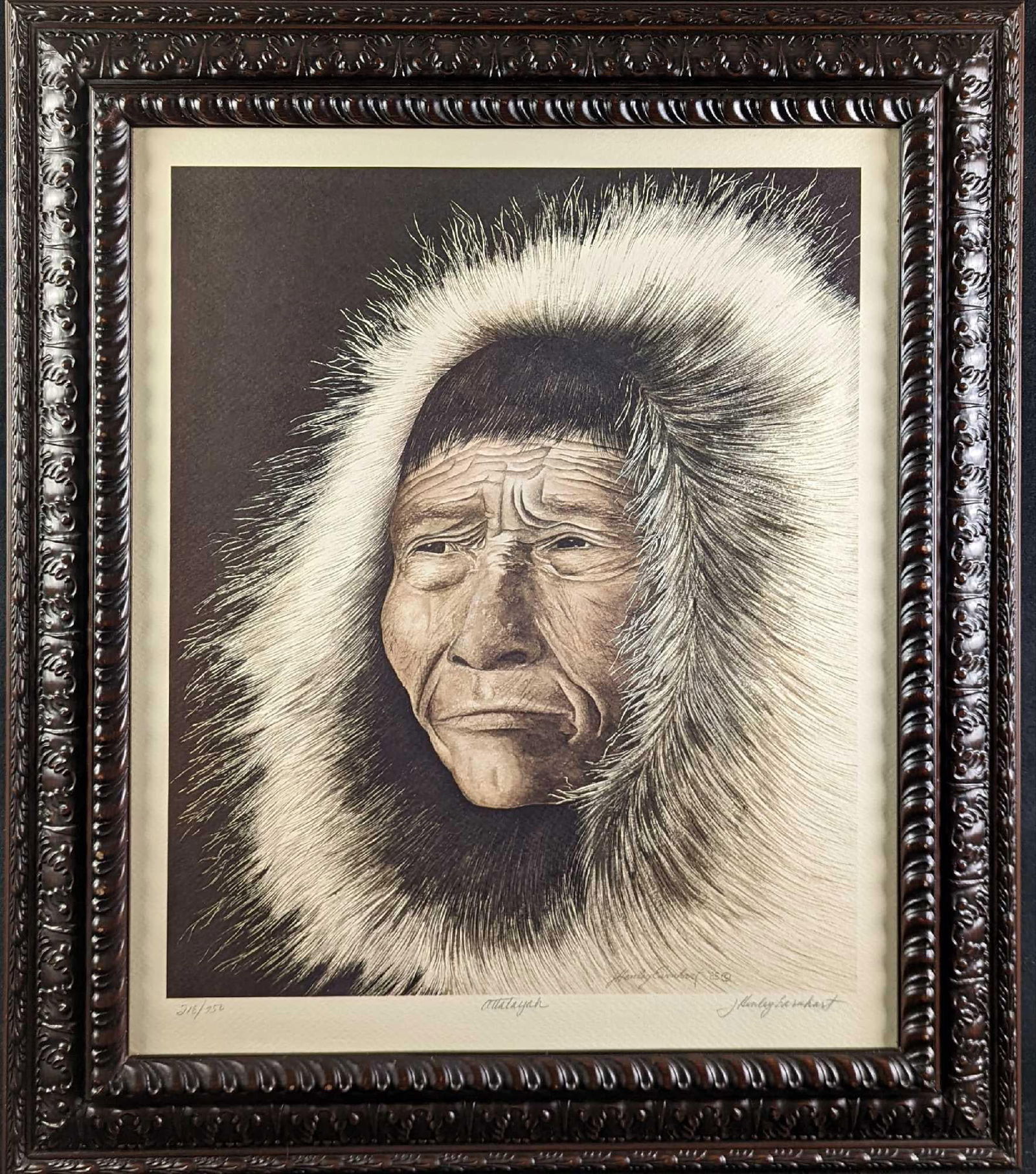 Framed LE J Hemley Earnhardt Elderly Inuit Print: Here is an nicely framed print by artist J Hemley Earnhardt of an rather elderly Inuit dressed in furs. The print is signed and numbered by the artist on the bottom border. This print is #218 out