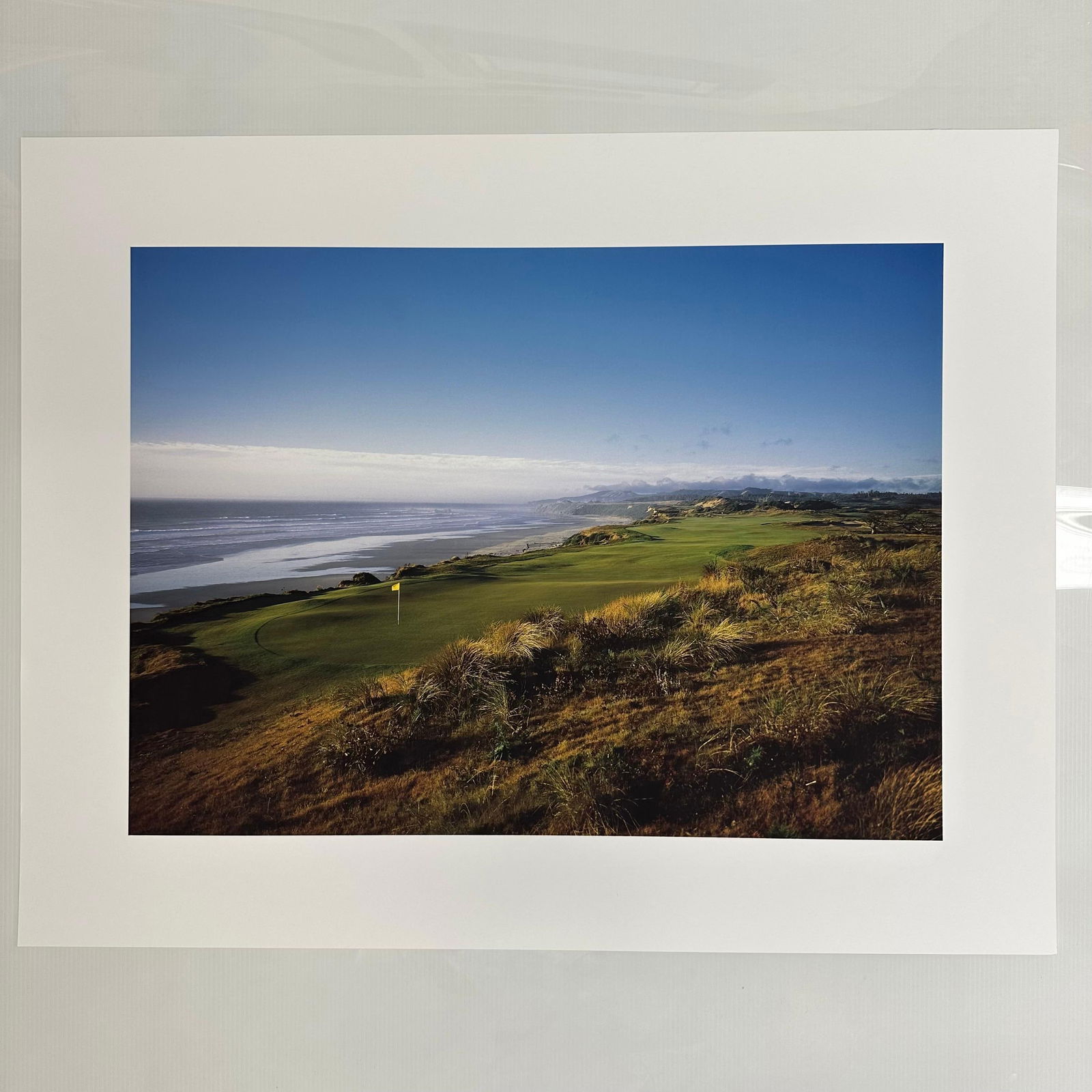 Bandon Dunes Golf Resort Coastal Links View Color Photograph Print Oceanfront Fairway Landscape: Golf Digest Collection color photograph print depicting a sweeping oceanfront golf course view under clear blue skies. The image captures the natural beauty of a links-style course bordered by dunes,
