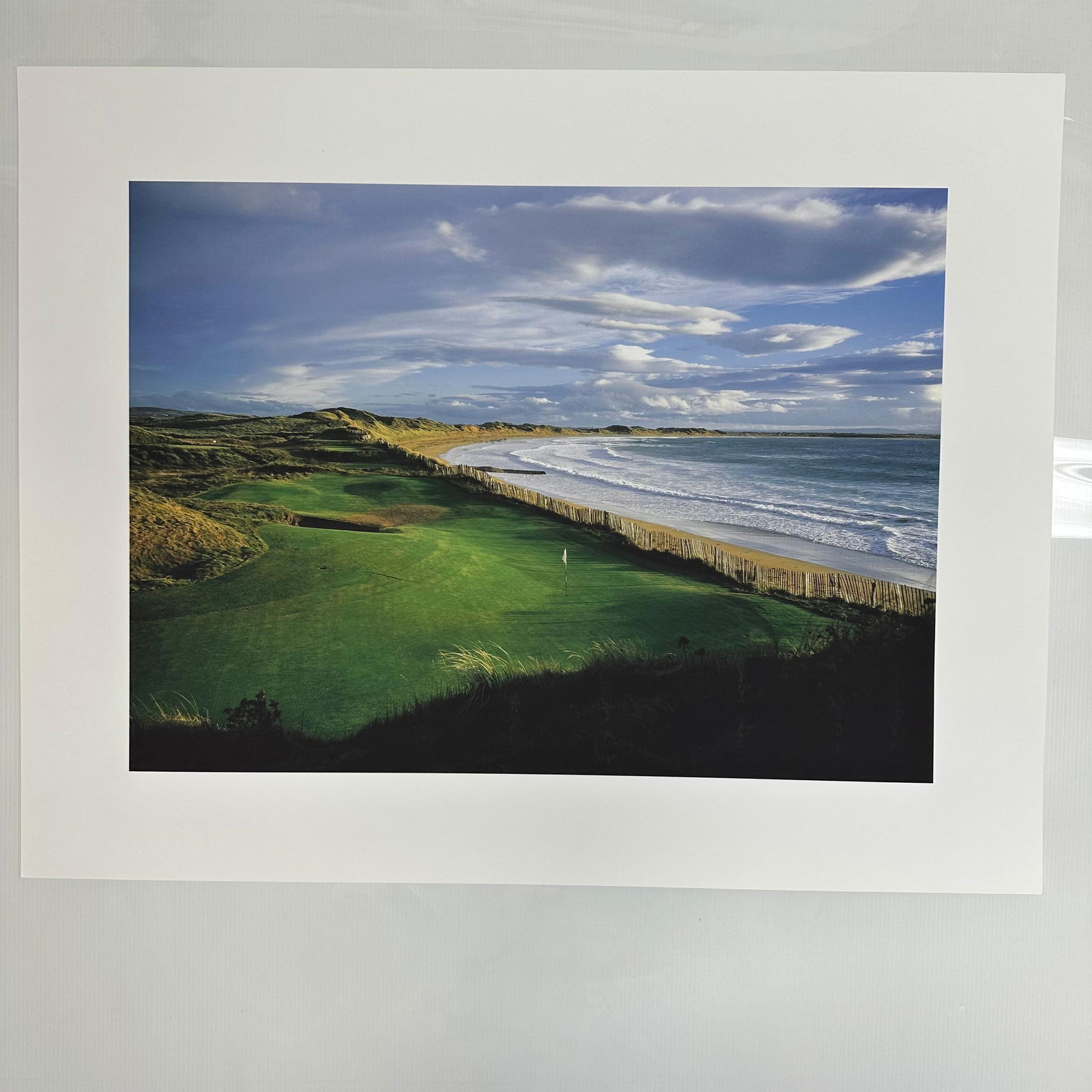 Golf Digest Collection 11th Hole Ballybunion Golf Course Coastal Landscape Photo Print: Golf Digest Collection color photograph print depicting a stunning coastal golf course fairway overlooking the ocean under vivid blue skies and rolling clouds. Unmarked on reverse, includes original e