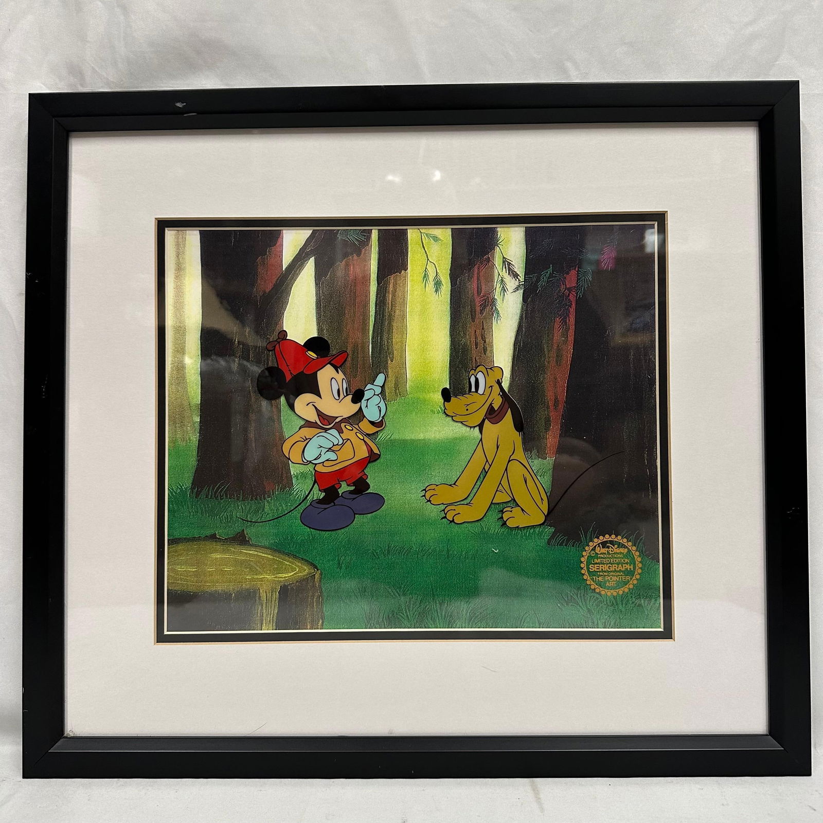 Disney Serigraph Cel the Pointer Mickey Mouse and Pluto Framed Artwork LE: Framed Walt Disney Productions limited edition serigraph from the classic short “The Pointer,” featuring Mickey Mouse and Pluto in a forest scene. Marked with the official Disney serigraph sea