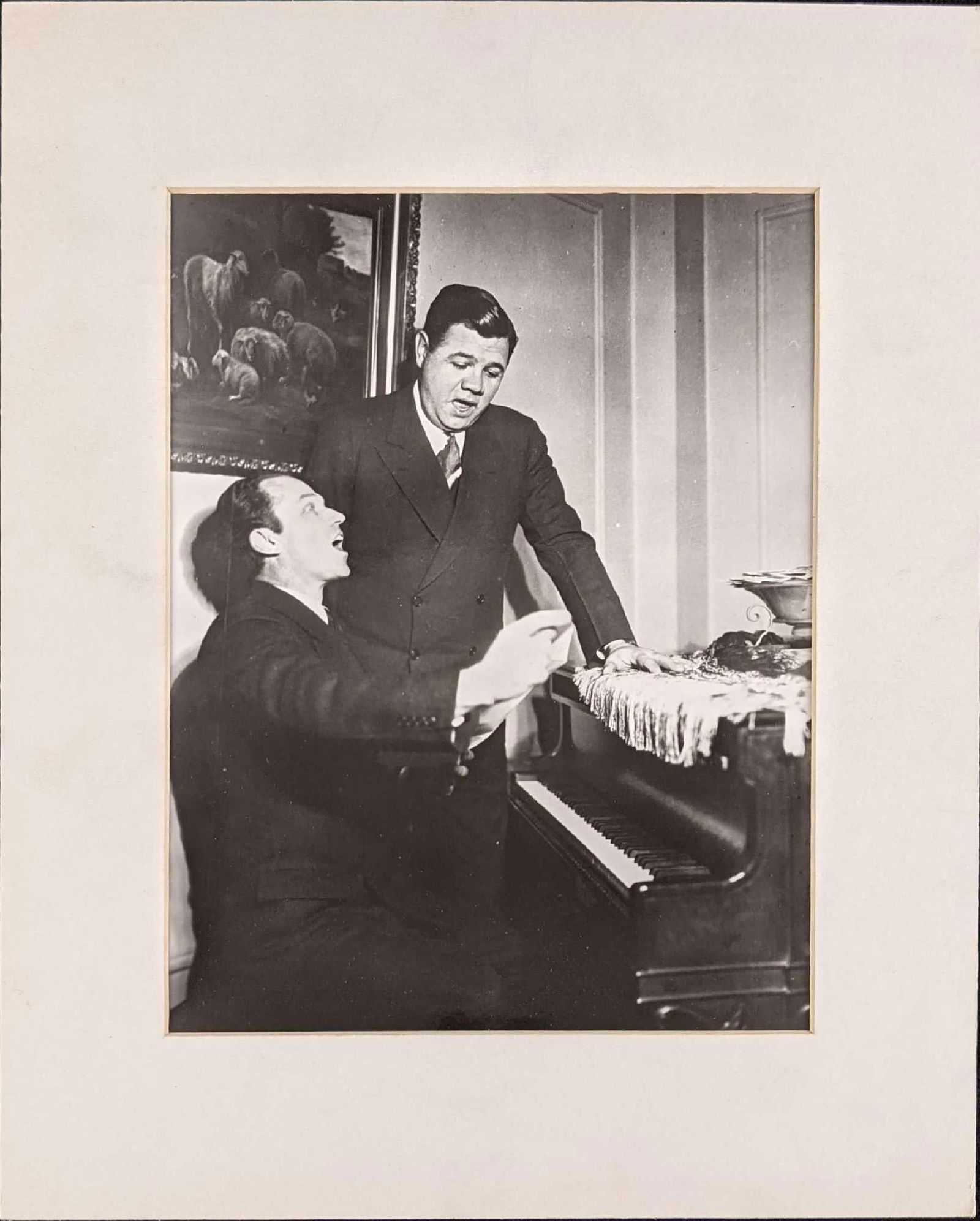 Photo Of Babe Ruth & Piano Player: Here is a nice matted glossy photo print of Babe Ruth and an unknown piano player who plays the piano while the Babe sings along. The matted photo is approx 10 3/4" x 13 1/4" and it weighs under one p