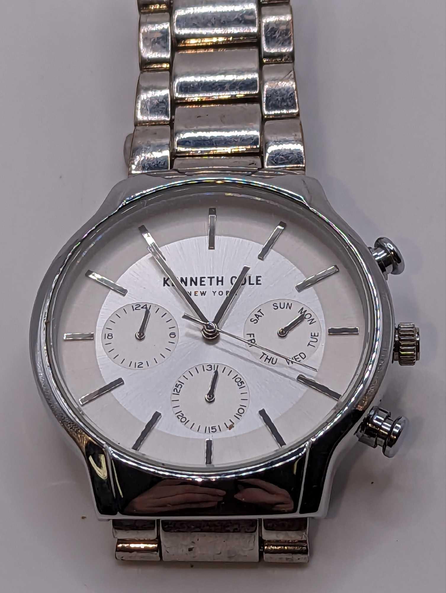 Kenneth Cole Men's Multifunction Silver Tone Watch: Kenneth Cole Men's Multifunction Silver Tone Watch. Movement - quartz multi-functionCase - round, silver-tone stainless steel, 42mmStrap - silver-tone stainless steel with push button clasp