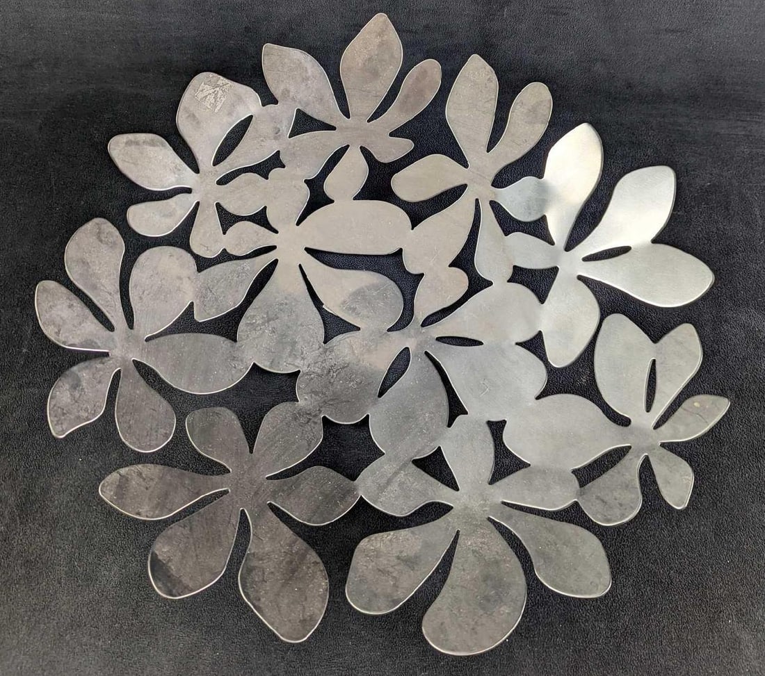 IKEA Stockholm Monika Mulder Flower Bowl: IKEA Stockholm Monika Mulder Flower Bowl. Made of stainless steel. The bowl is approx 16" x 17" x 3 1/2" and it weighs 3.36lbs. The bowl is in a good, used condition with some signs of wear and sticke