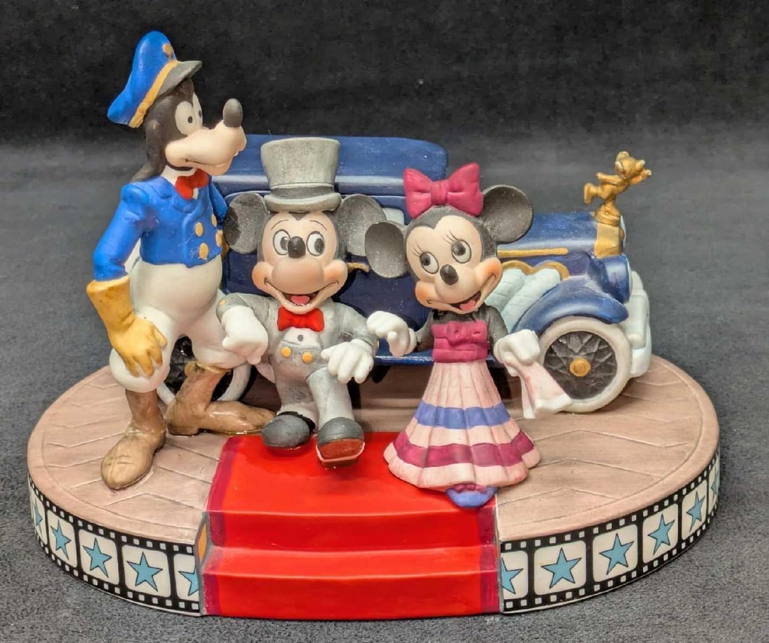 Vintage Disney Mickey And Minnie Mouse With Limo: Vintage Disney Mickey And Minnie Mouse With Limo. This ceramic figurine was stamped "Made In Japan" on the bottom of the base. This is approx 6 1/2" x 8 1/4" x 6 1/2" and it weighs 2.10lbs. There appe
