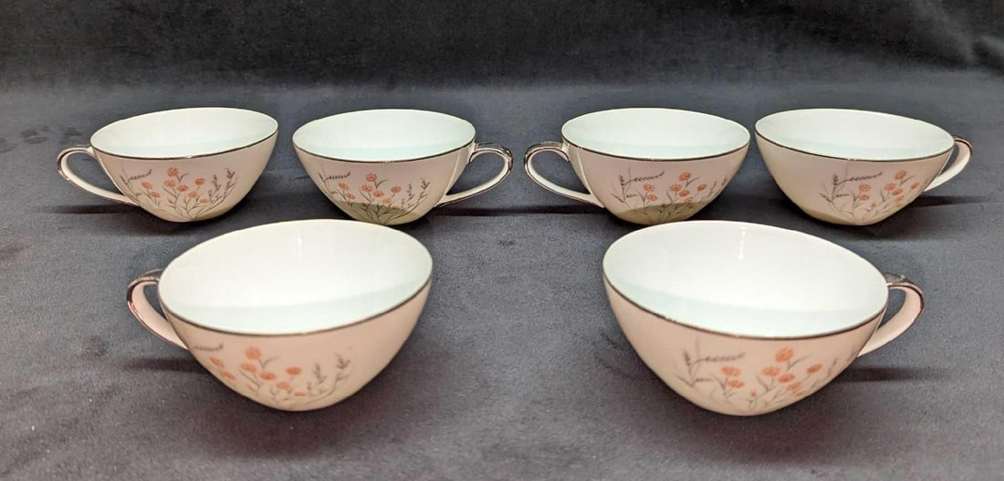 6 Retired Jyoto China Spring Cups: 6 Retired Jyoto China Spring Cups. Each cup is approx 5" x 4 1/4" x 2" and the total weight is 1.32lb. There is some wear on the trim and handle.