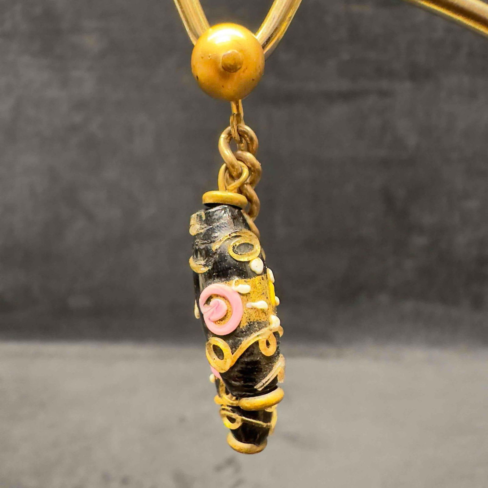 Murano Venetian Art Glass Lamp Work Black Floral Gold Toned Bead Dangle Drop Earrings F24: Murano Venetian Art Glass Lamp Work Black Floral Gold Toned Bead Dangle Drop Earrings F24. Earrings with black glass beads with beautiful designs on each. The earrings feature floral and gold colored