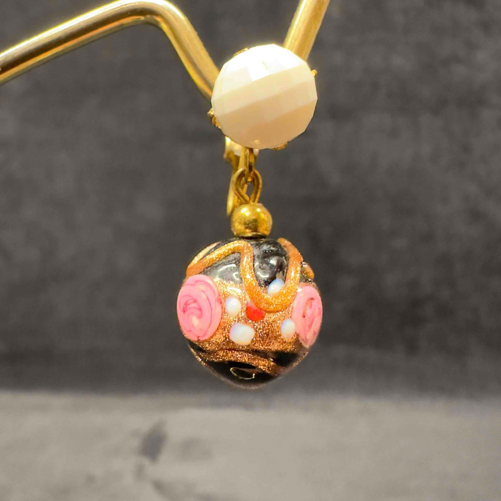 Murano Venetian Art Glass Lamp Work Black Floral White Beaded Dangle Earrings F25: Murano Venetian Art Glass Lamp Work Black Floral White Beaded Dangle Earrings F25. Earrings with black glass beads with beautiful designs on each. The earrings feature floral and copper colored accent