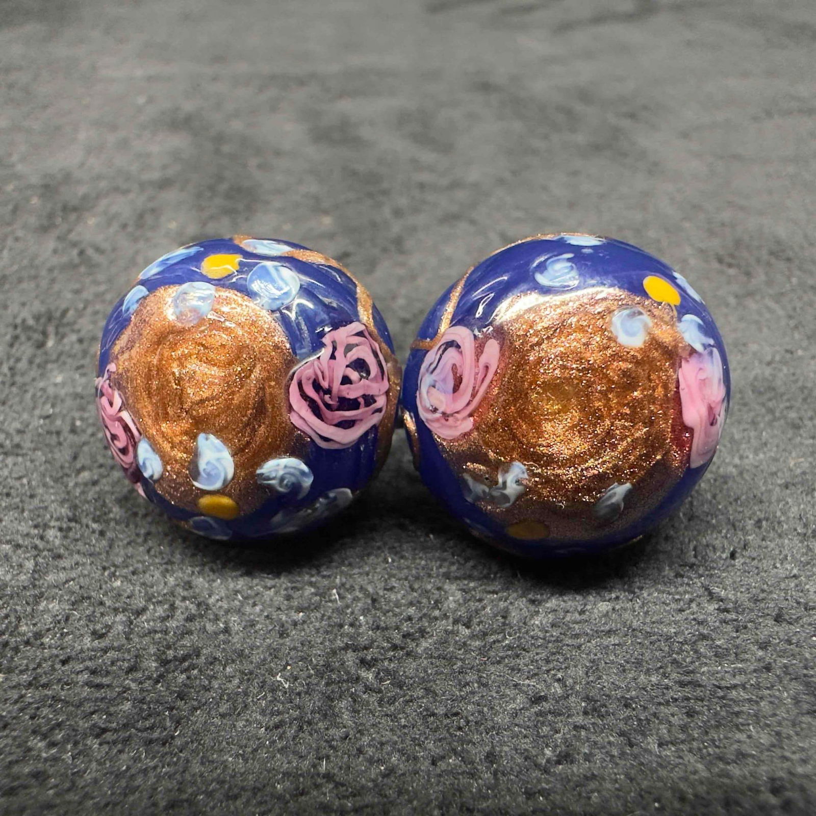Murano Venetian Art Glass Lamp Work Dark Blue Floral Copper Accents Circle Bead Earrings F35: Murano Venetian Art Glass Lamp Work Dark Blue Floral Copper Accents Circle Bead Earrings F35. Earrings with dark blue glass beads with beautiful designs on each. The earrings feature floral and copper
