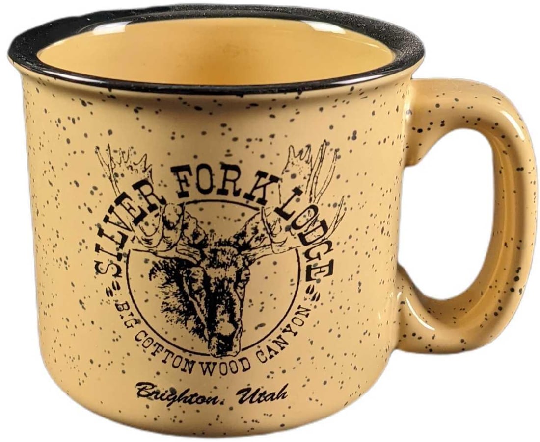 Silver Fork Lodge Brighton Utah Souvenir Mug: Silver Fork Lodge: Big Colton Wood Canyon, Brighton, Utah souvenir mug. This souvenir mug is made from ceramic and features a Moose. It is a pale yellow with a pecked dots and is in great condition wi