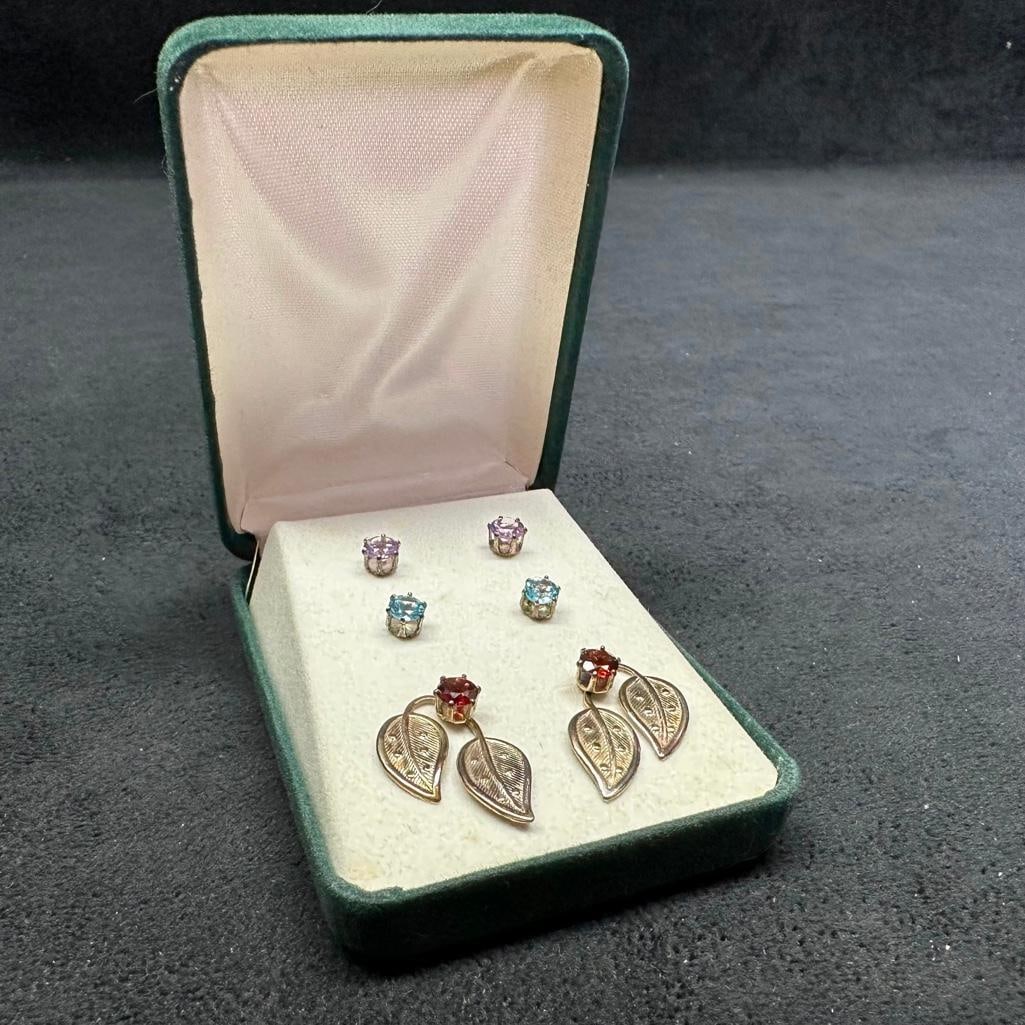 3 Pairs of Colored CZ Sterling Earrings: This piece of jewelry has been tested and researched prior to listing. Please view all our pictures they are part of our description. DETAILS: Metal - Sterling Silver Color - Silver Stones - CZ Hallm