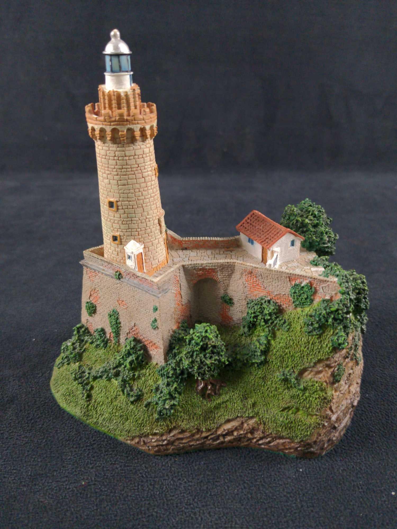 Danbury Mint Portoferraio Italian Lighthouse: "Portoferraio Lighthouse", Elba Island, Italy, by Danbury Mint. Was released in 1994. Is approx 6" x 5" x 6". Part of Danbury's "Historic International Lighthouse" collection. Hand-painted resin. Is i