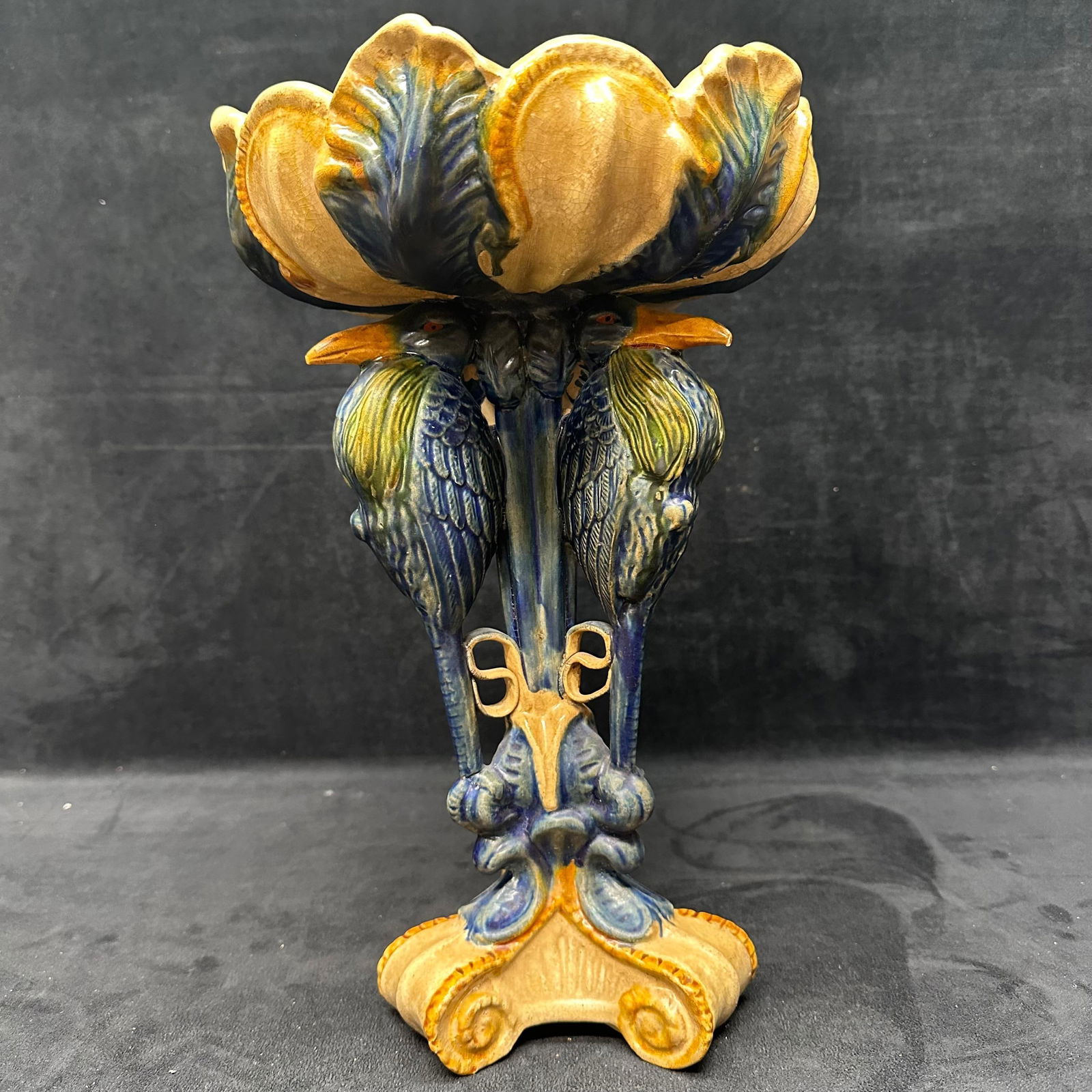 Vintage Amphora Style Figural Bird Compote Tri Footed Leaf Bowl Pottery Jim Marvin Collection: Decorative ceramic pedestal bowl featuring an ornate sculptural form with stylized bird figures supporting a scalloped bowl. Finished in a multicolor glaze with blue, gold, and earth-tone accents. The