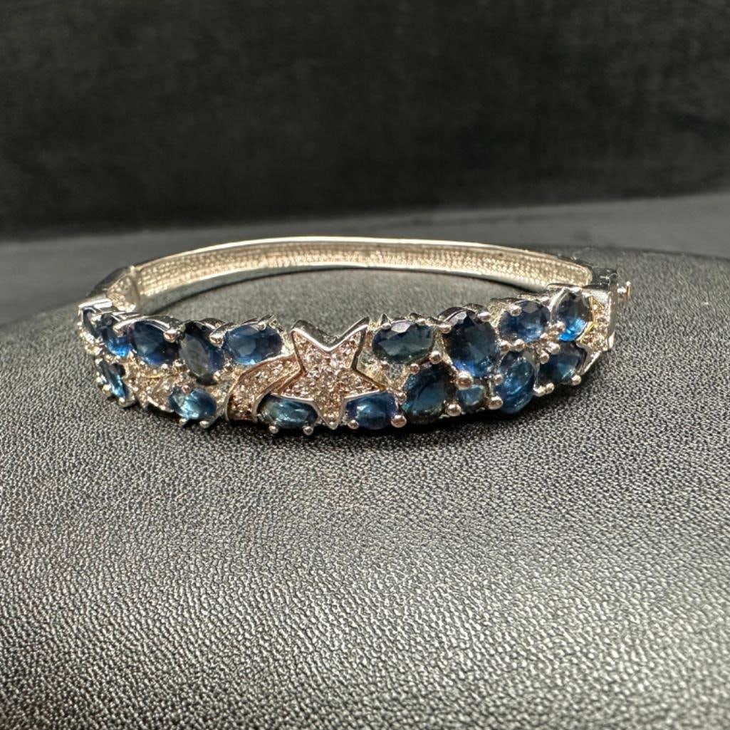 Sterling CZ Hinged Shooting Star Bracelet: This piece of jewelry has been tested and researched prior to listing. Please view all our pictures they are part of our description. DETAILS: Metal - Sterling Silver Color - Silver Stones - Cubic Zi
