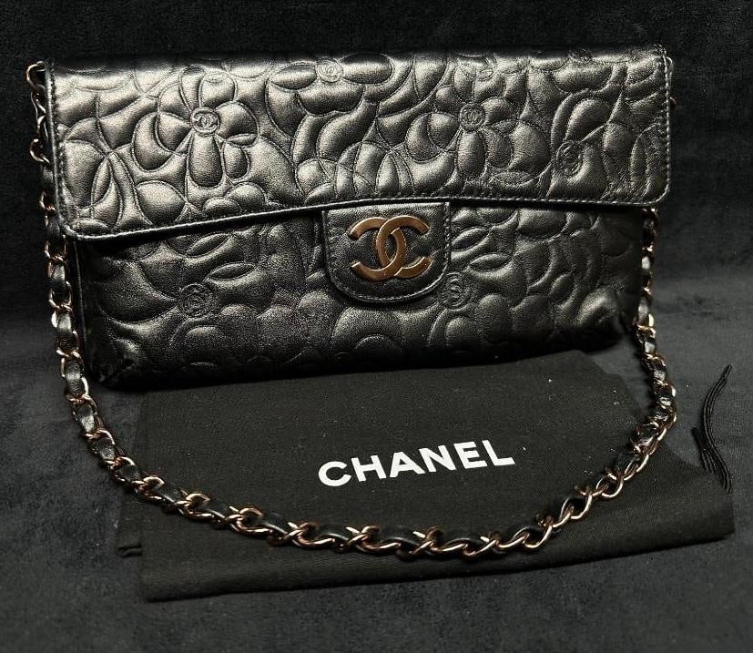 Chanel Lambskin Flap Bag Camellia Quilting: Chanel Lambskin Flap Bag Camellia Quilting Chanel flap bag in black lambskin, with a floral "Camellia" pattern quilting. In good condition with no known damage. The bag is very gently used a