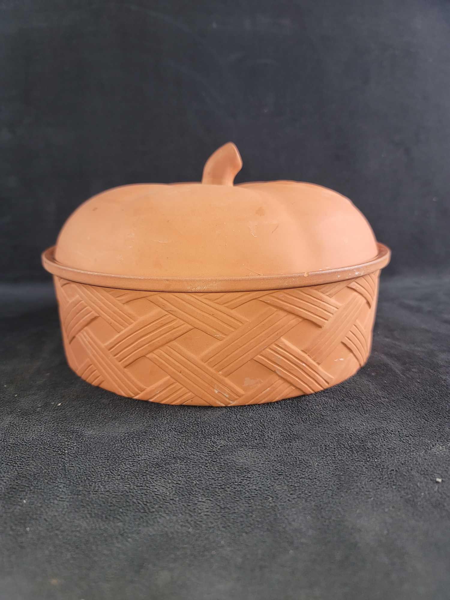 Dutch Pie Oven Earthenware: Round Clay Dutch oven for any dessert you would love to bake. The top is shaped like an apple and the bottom has a basketweave. The bottom is glazed, and there is some crazing. The maker and date are