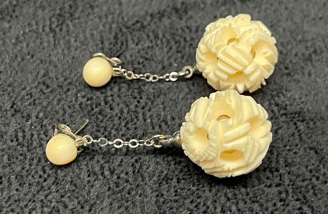 Hand Carved Bone Circle Balls Dangle Earrings: This lot contains Hand Carved Bone Circle Balls Dangle Earrings. Each earring is approx 1 1/2" x 3/4" x 3/4". Total weight is approx less than 1 gram. Overall the Hand Carved Bone Circle Ball Dangle E