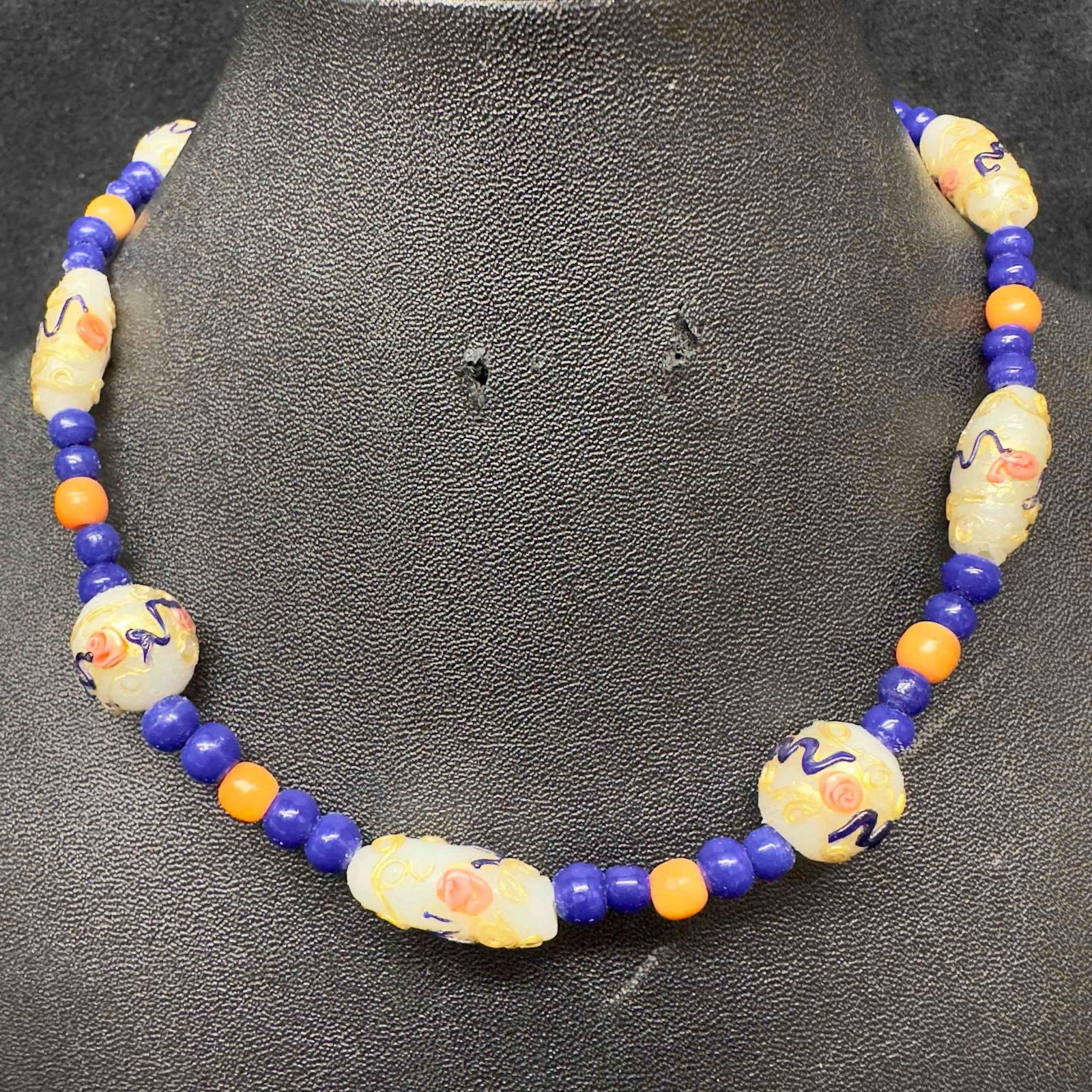 Murano Venetian Lamp Work Glass Art White Floral Blue Peach Colored Accents Beaded Necklace E88: Murano Venetian Lamp Work Glass Art White Floral Blue Peach Colored Accents Beaded Necklace E88. Necklace with white colored glass beads with a beautiful hand painted design on each. The necklace feat