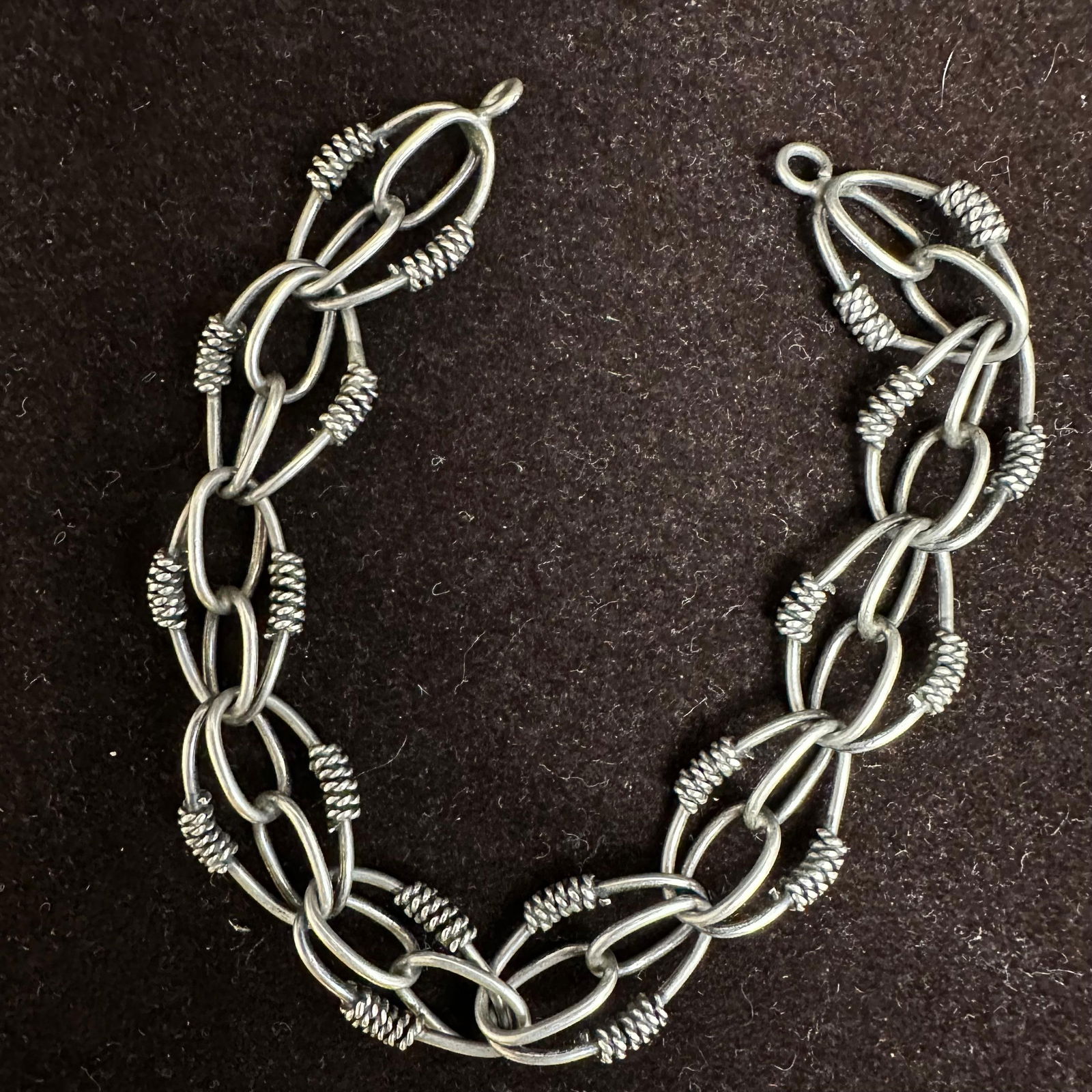 Etruscan Revival Style Silver Rope Motif Link Bracelet: This item is in good pre-owned, previously used/displayed condition with noticeable light wear and surface scratches. Please reference all photos for full details. This piece of jewelry has been teste