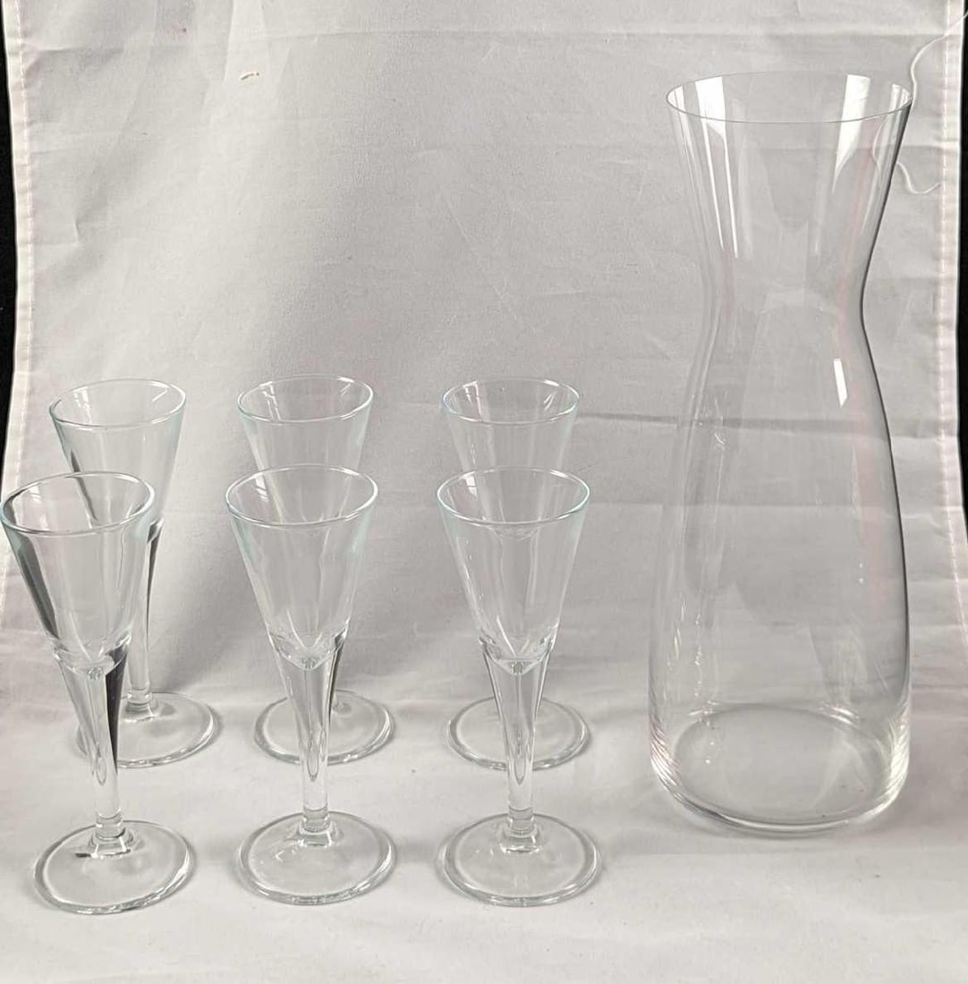 6 IKEA Svalka Snap Glasses Soeugekau Karaffe Glass: This lot includes: (6) IKEA Svalka Glass "Snap" Glasses. Each snap glass is approx 2" x 2" x 5 1/2". These glasses come in their original box which is approx 6 3/4" x 4 1/2