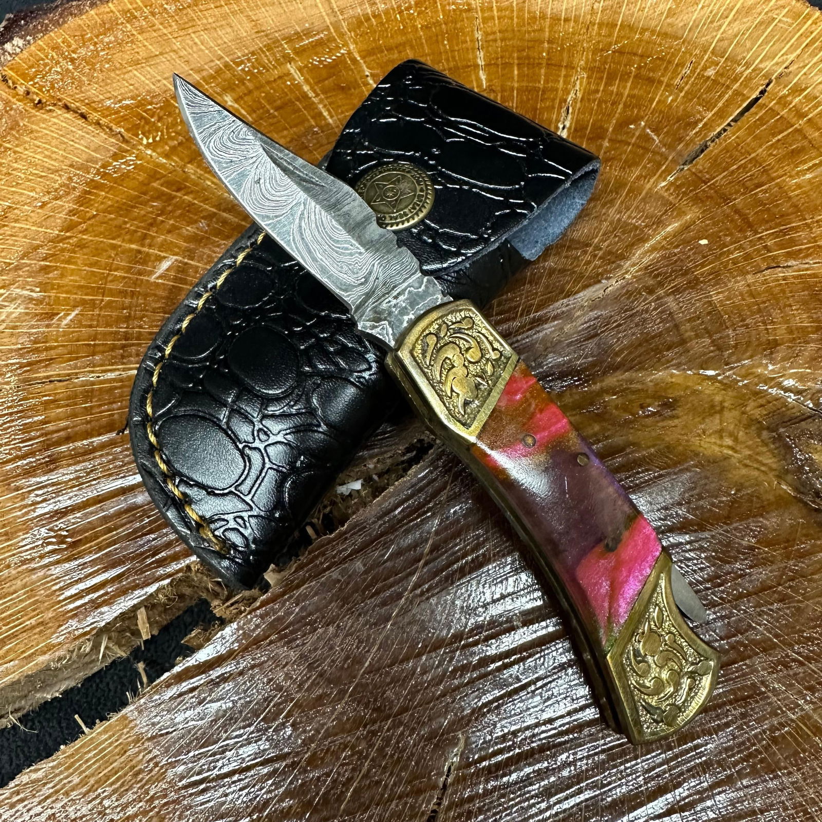 MHS Cutlery Steel Folded Blade Pocket Knife White Pink Green Accent Handle Q96: Folding blade pocket knife by MHS Cutlery featuring a layered patterned steel blade and decorative spine work. The decorative handle has a contoured, wood/resin-style grip with metal mosaic pin accent