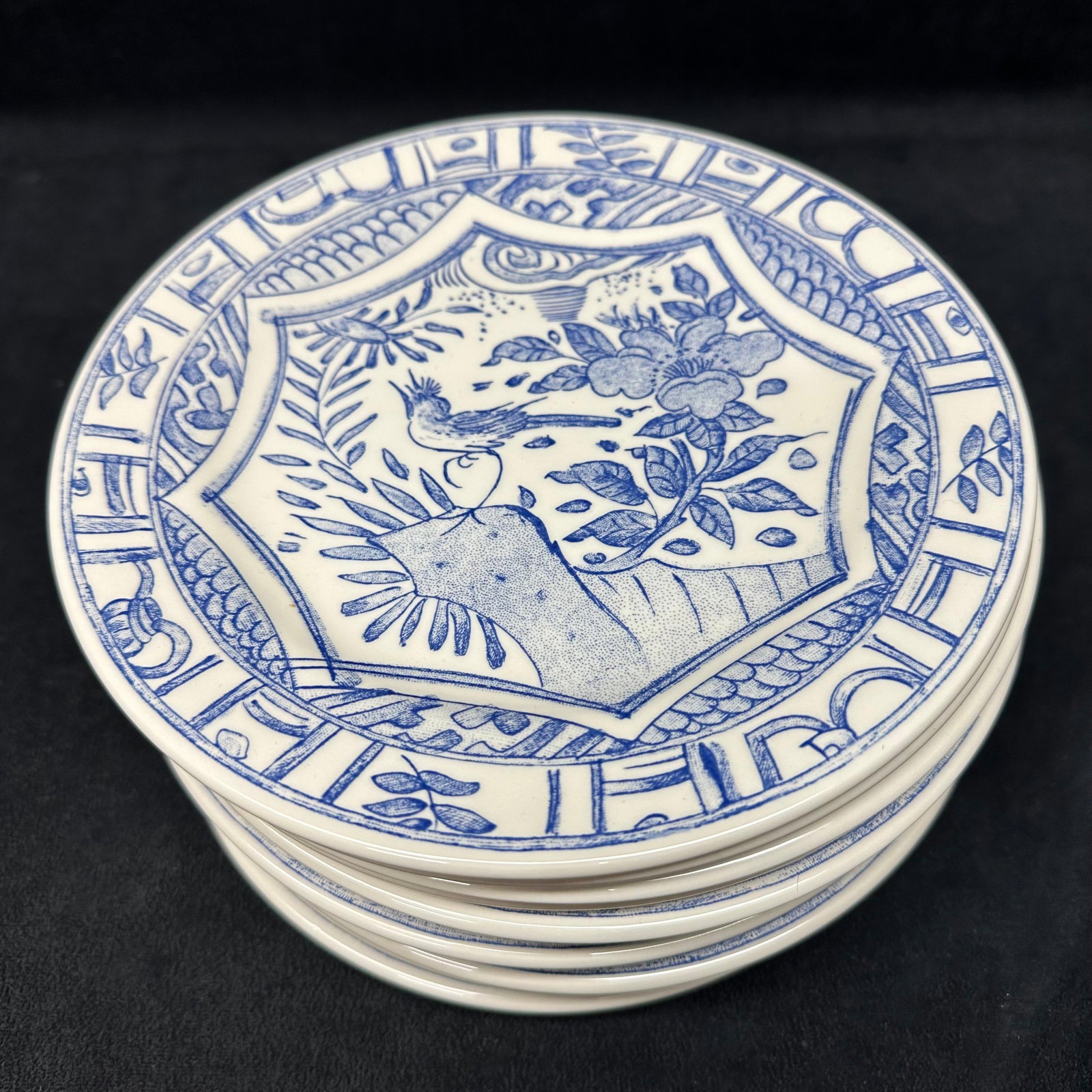 Gien France Oiseau Bleu Blue and White Porcelain Salad Plates Set of Twelve: Matching set of twelve porcelain plates by Gien, France. Plates feature a blue and white design with floral and bird motifs in the center, surrounded by a geometric border. All plates are marked on t