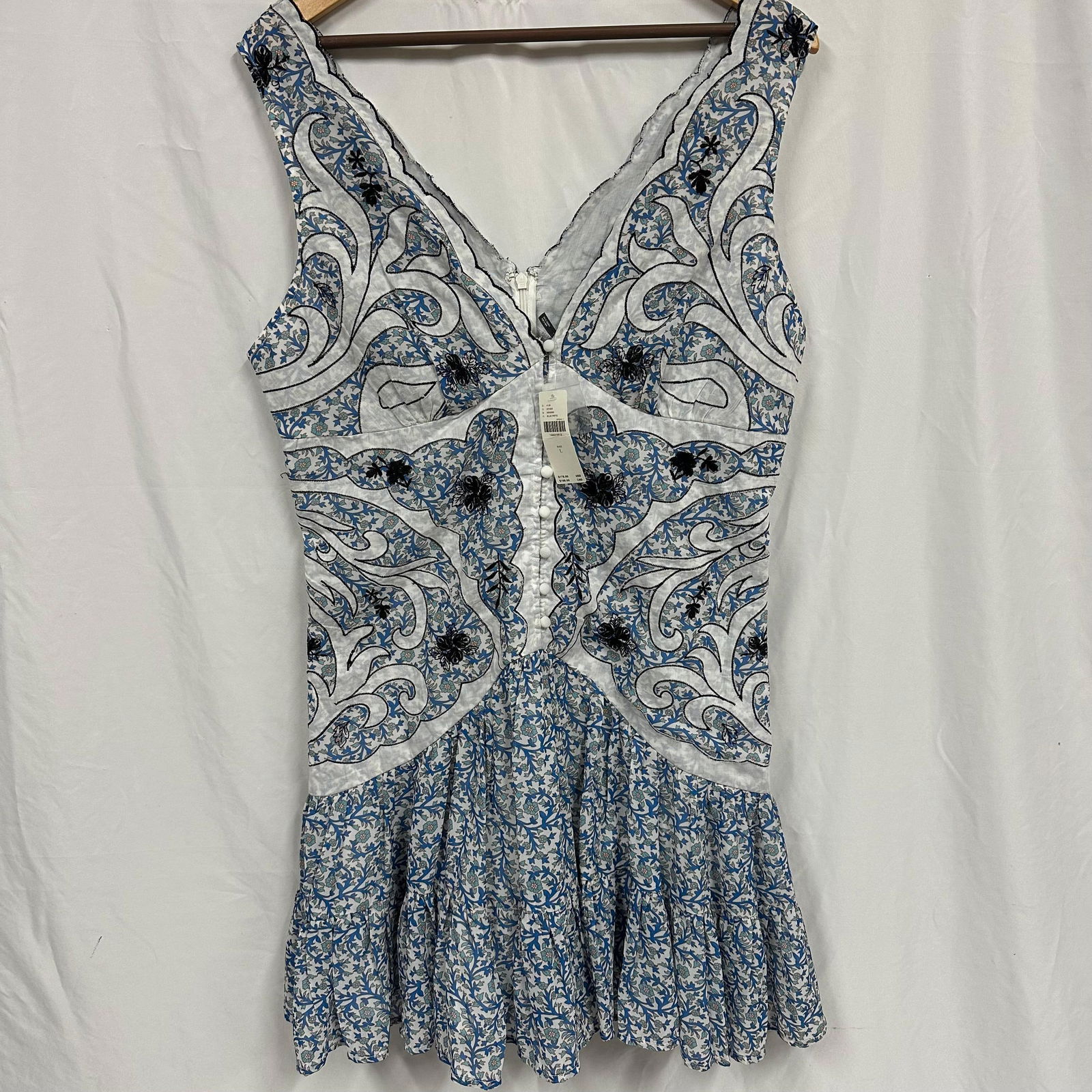 Anthropologie Women Sleeveless Embroidered Blue and White Dress Size L: Original tag still intact. Outfit appears clean and in good, like-new condition with light wrinkling consistent with wear and storage. No major stains, tears, or damage observed. Please reference all
