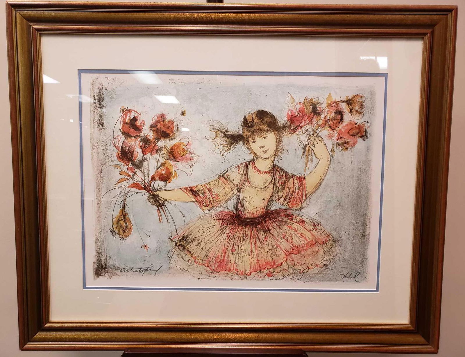 Edna Hibel Young Girl Framed Lithograph: Edna Hibel Young Girl Framed Lithograph. This print is in great condition. Print has a decently thick wooden frame and is double matted. The image depicted is of a young girl holding flowers. In the b