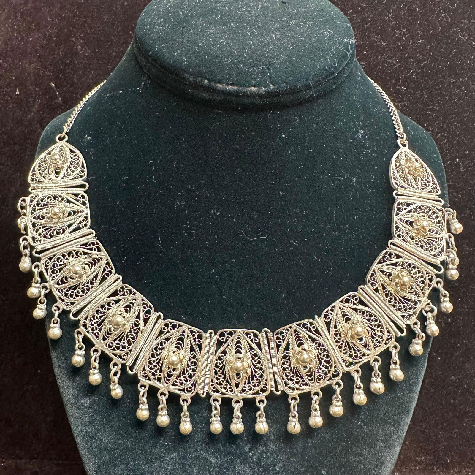 Silver Plated Filigree Fringe Necklace with Ornate Panels: Vintage necklace featuring an elaborate filigree design composed of multiple decorative panel links. Each panel displays fine wire work with floral and scroll motifs, joined by coiled wire connectors.