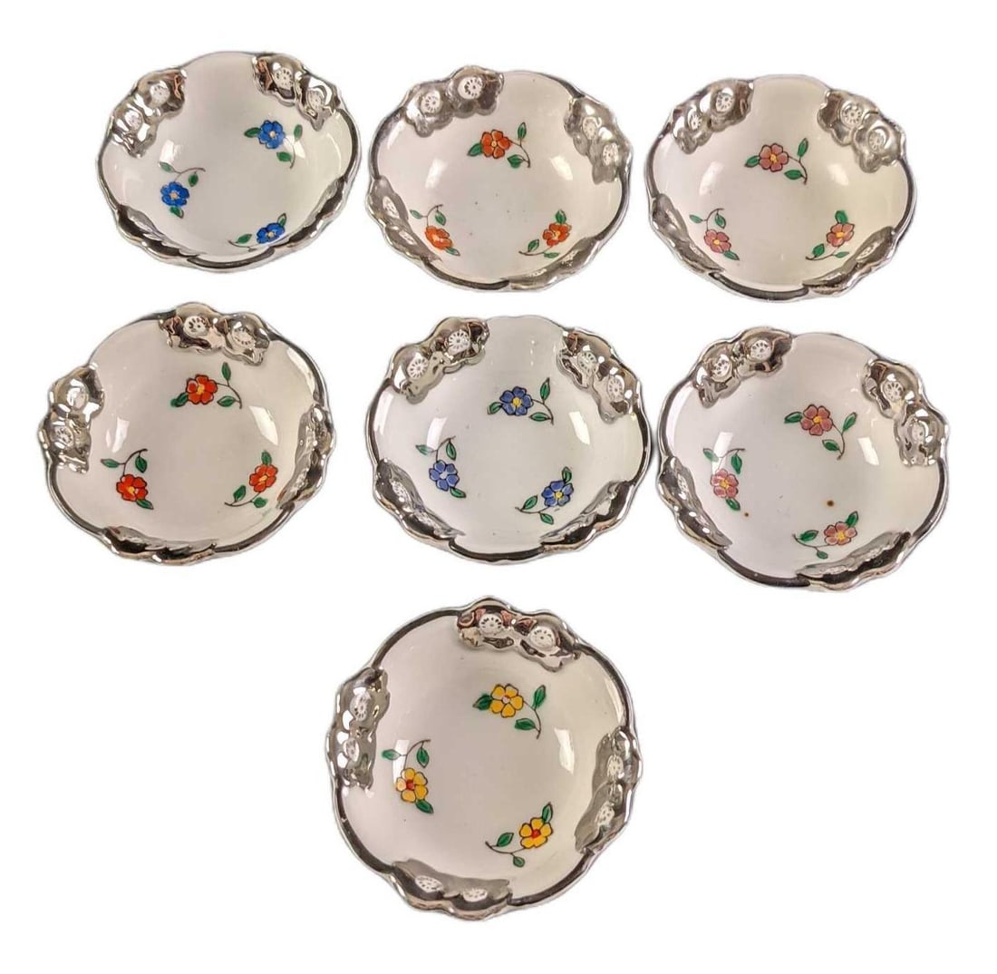 Seven Vintage Mini Japanese Sake Porcelain Cups: Made in the Toki Gifu Prefecture. Each cup is approx 2 1/4" x 2 1/4" x 1" and weighs altogether under one pound at 0.45lb. Each cup has hand-colored flowers and trim. Please note, the graphics we