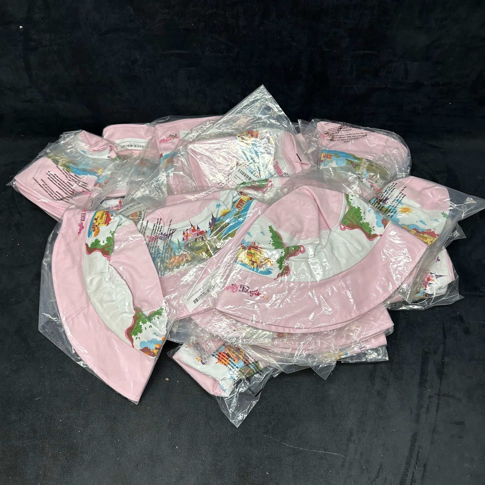 Disney Parks Once Upon A Time Happily Ever After Pink Bucket Youth Hat 29 Set: 29 Disney Parks Hats total Exclusive Disney Theme Parks item Floppy bucket hat Castle artwork with Once Upon a Time Happily Ever After embroidery Material: 100% cotton. Color: pink and white Youth si