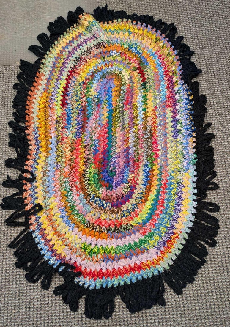 Vintage Hand Braided Multicolor Oval Rug: Vintage Hand Braided Multicolor Oval Rug. This is approx 28" x 48" x 1".Folded, the rug is approx 15" x 15" x 3" and it weighs 3.30lbs. There is some signs of wear on the rug. Please see the images as