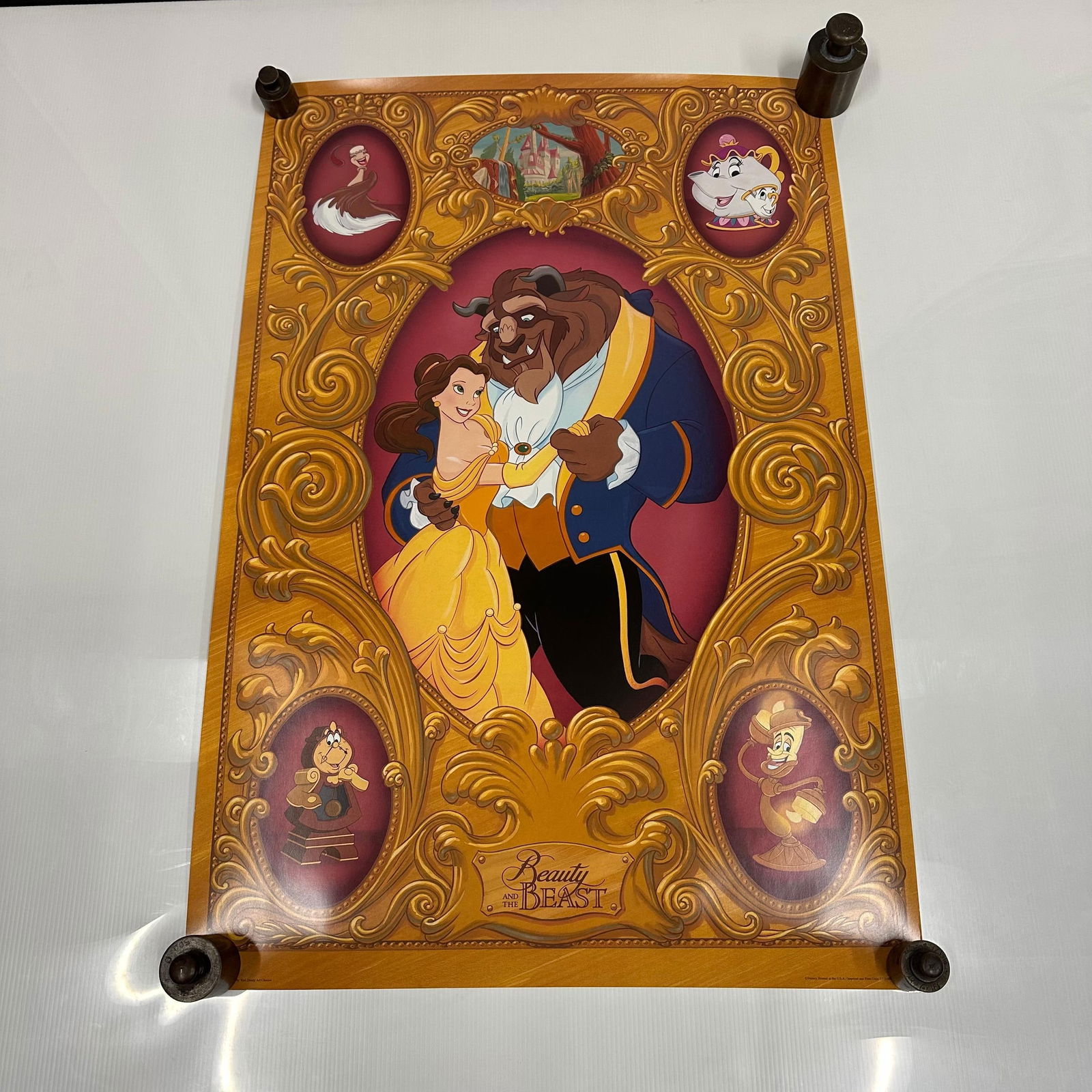 Disney Beauty and the Beast Decorative Poster Wall Art Belle Gold Ornate Design: Colorful Disney Beauty and the Beast poster featuring Belle and the Beast in an ornate gold frame design. Character portraits include Lumiere, Cogsworth, Mrs. Potts, and others. Mounted with four deco