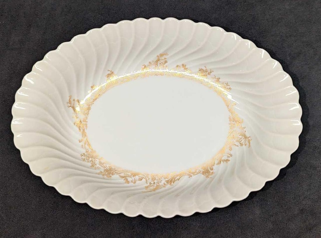 Retired Haviland Ladore 10" Oval Vegetable Bowl: Retired Haviland Ladore 10" Oval Vegetable Bowl. This Gold on White series of fine china was released in 1962 - 1988. The vegetable bowl is approx 10 3/4" x 7 1/2" x 2 1/4" and it weighs