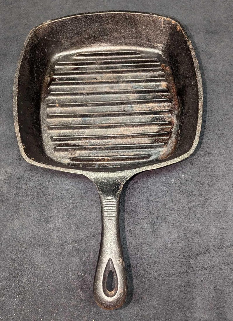 Emeril Lagasse Cast Iron 10" Square Skillet Fry Pan: Emeril Lagasse Cast Iron 10" Square Skillet Fry Pan. This is approx 10 1/4" x 3" x 16 1/4" and it weighs 6.57 lbs. The skillet has some light surface rust, some markings, and signs of wear. Please