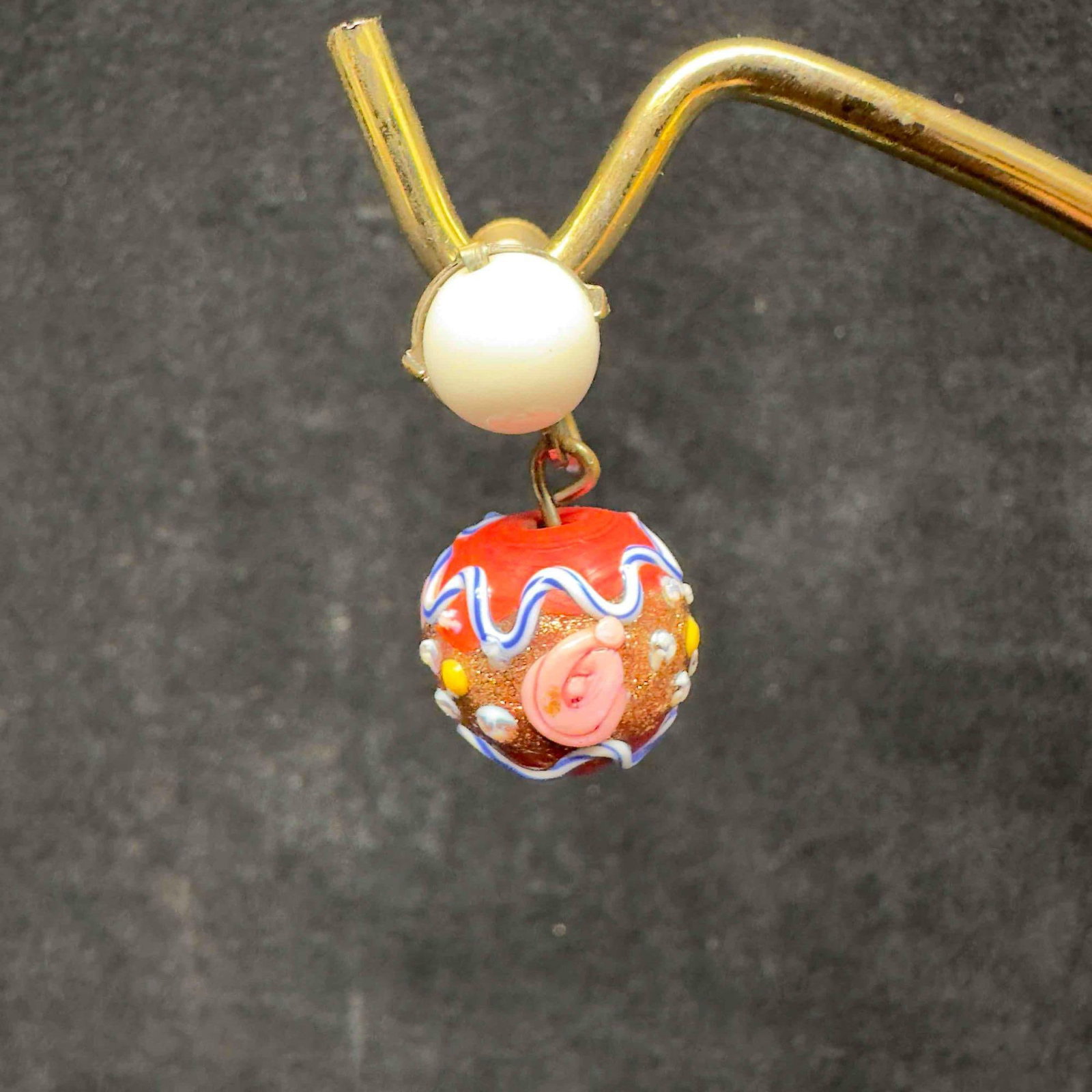 Murano Venetian Lamp Work Art Glass Red and White Bead Floral Blue Accent Earrings E36: Murano Venetian Lamp Work Art Glass Red and White Bead Floral Blue Accent Earrings E36. Earrings with red colored glass beads with beautiful hand painted designs on each. The earrings feature blue and