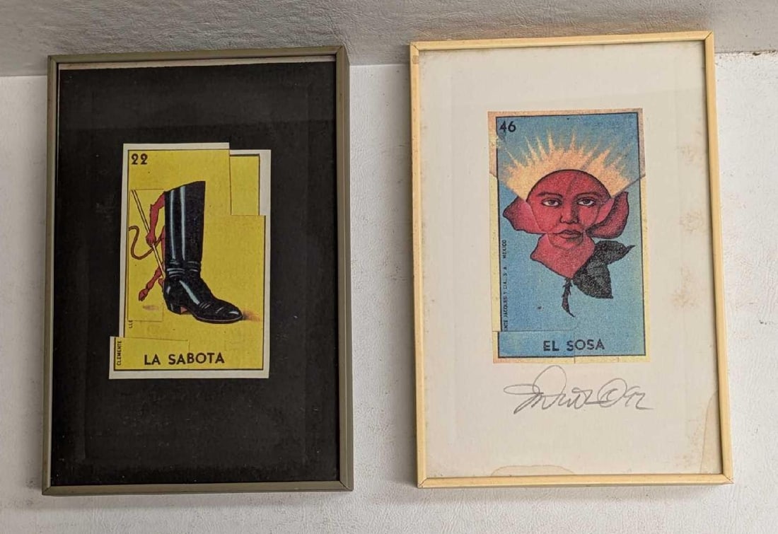 2 Framed Don Clemente Loteria Cards: 2 Framed Don Clemente Loteria Cards.Each is approx 4 1/4" x 3/4" x 6 1/4" and the total weight is 0.68lb. The "El Sosa" card has some stains/markings on the edges. This is also signed, not by Don