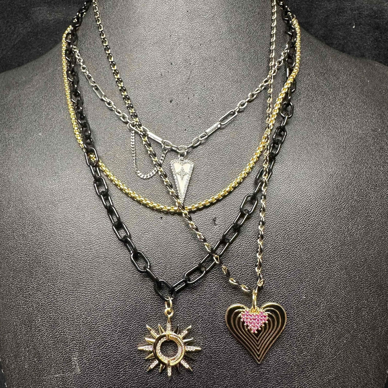 Melania Clara Multi Strand Modern Chain Design Necklace Set: The Melania Clara necklace set features a magnet clasp closure. The necklaces have magnet extender clasp closures. Each necklace showcase modernist designs. These items are in good pre-owned,