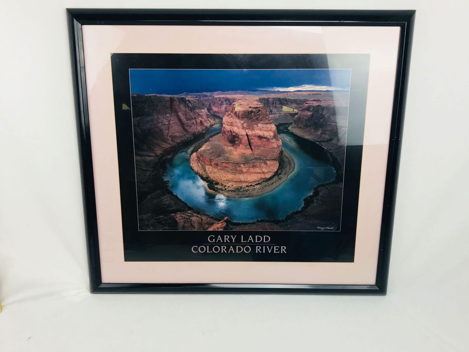 Large Framed Print of Horseshoe Bend in Marble Canyon, Colorado River, by Gary Ladd: Large Framed Print of Horseshoe Bend in Marble Canyon, Colorado River, by Gary Ladd, signed. The print is matted and glazed, framed in a black frame. The print is in good condition, with some minor sc