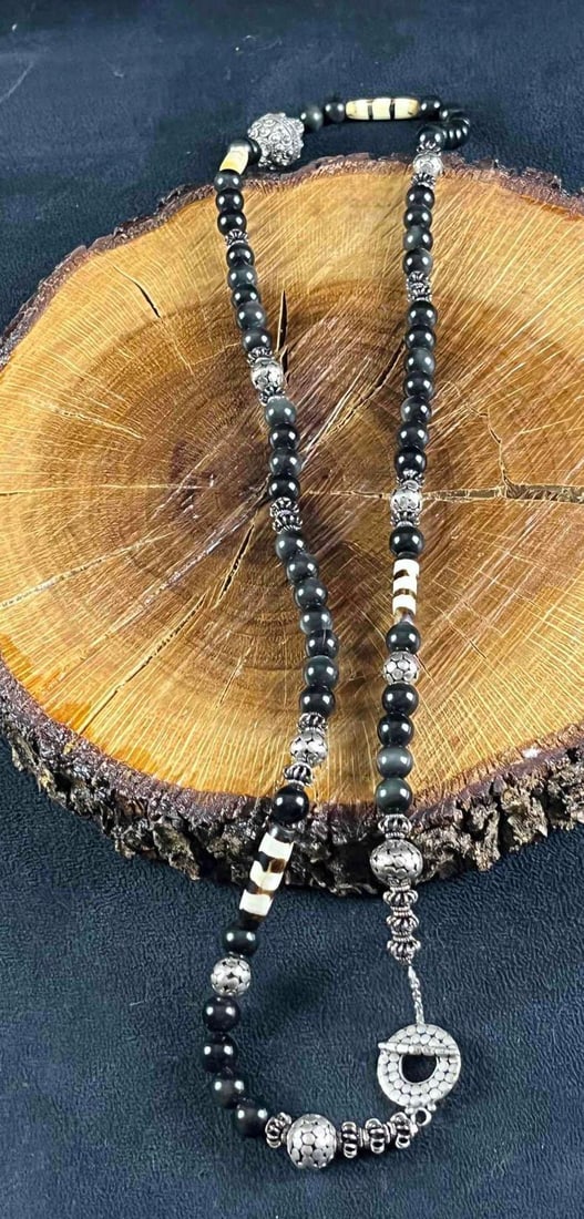 Natural Black Stone and Sterling Silver Necklace: Natural Black Stone and Sterling Silver Necklace This is a handmade necklace by jeweler Christina Dickson. Dickson only used the finest materials such as natural stones and sterling silver hardware. T