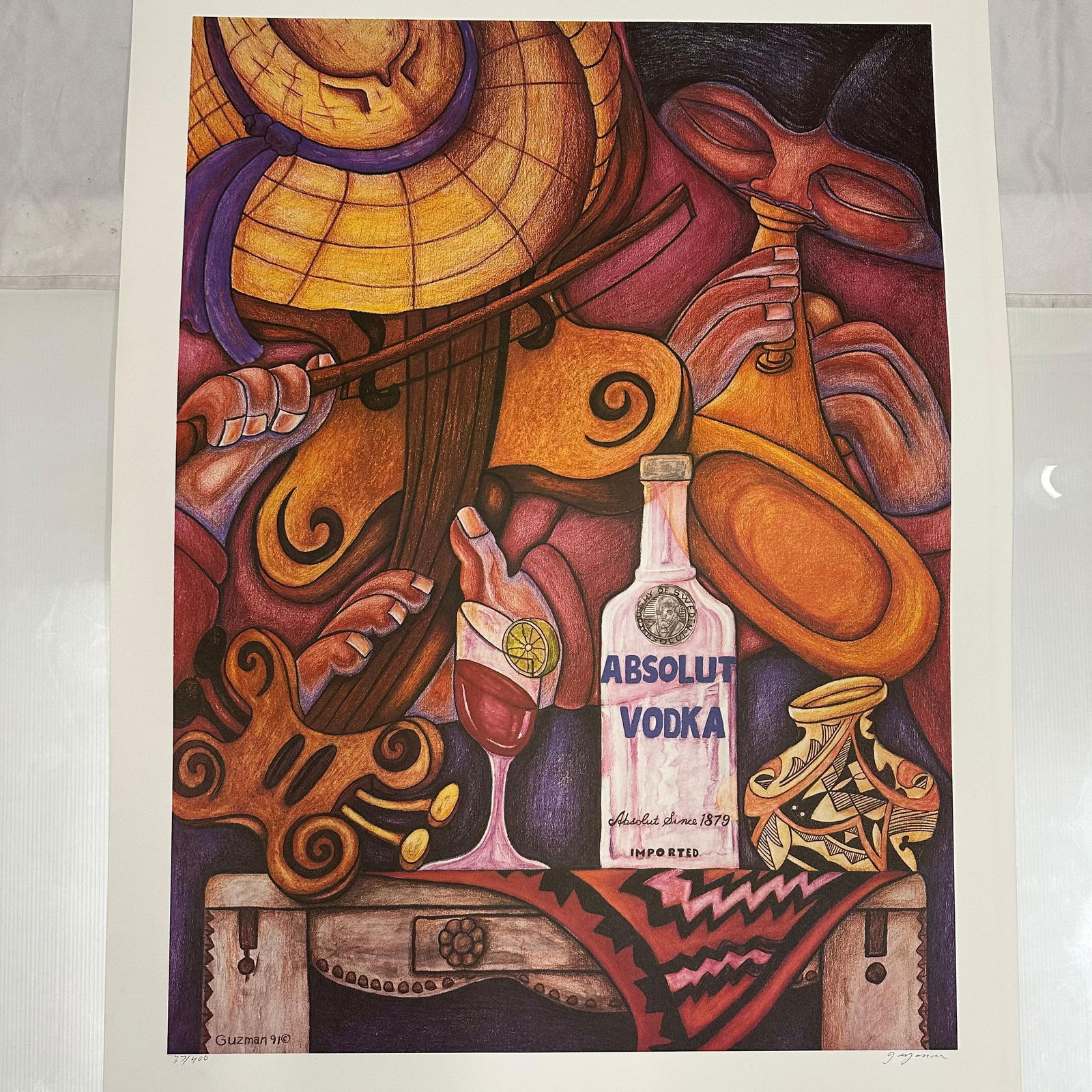 Absolut Vodka Statehood New Mexico Gilberto Guzman Print Signed 37/400: Limited edition Absolut Vodka “Statehood” lithograph print on paper. Features the iconic Absolut bottle incorporated into a stylized New Mexico-themed landscape composition. Hand-signed by