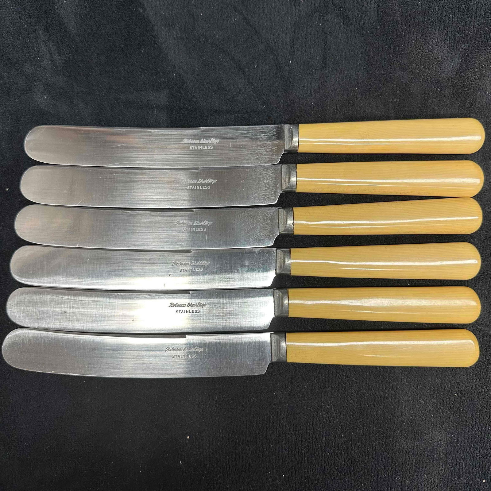 Robeson ShurEdge Stainless Steel Butter Knives Set of 6 Butterscotch Handle Knife: Includes blue dust jacket protector. These items are in great pre-owned, previously displayed condition with light wear and surface scratches. Please see all photos for full details. Knives: 9 1/4"