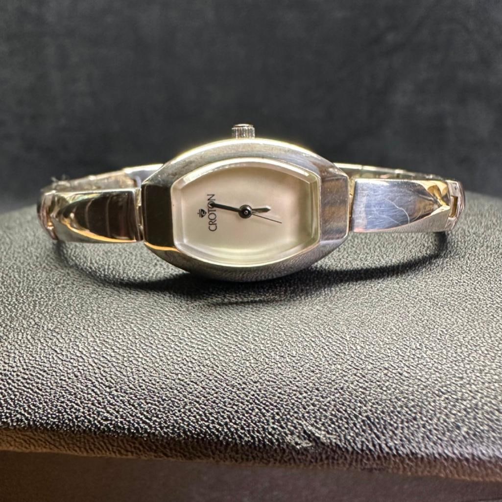 Ladies Croton Sterling Silver Quartz Watch: This piece of jewelry has been tested and researched prior to listing. Please view all our pictures they are part of our description. DETAILS: Metal - Sterling SilverColor -SilverStones -